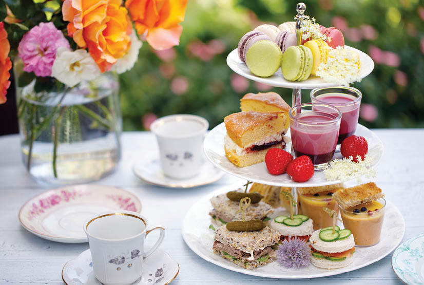 Traditional english afternoon tea with cakes and sandwiches