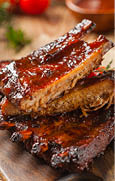 Roasted pork ribs. Served with Honey BBQ sauce.