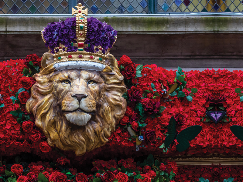 London, UK - April 30th 2023: The beautifully decorated exterior of The Ivy restaurant on West Street in London, to commemorate the Coronation of King Charles III.