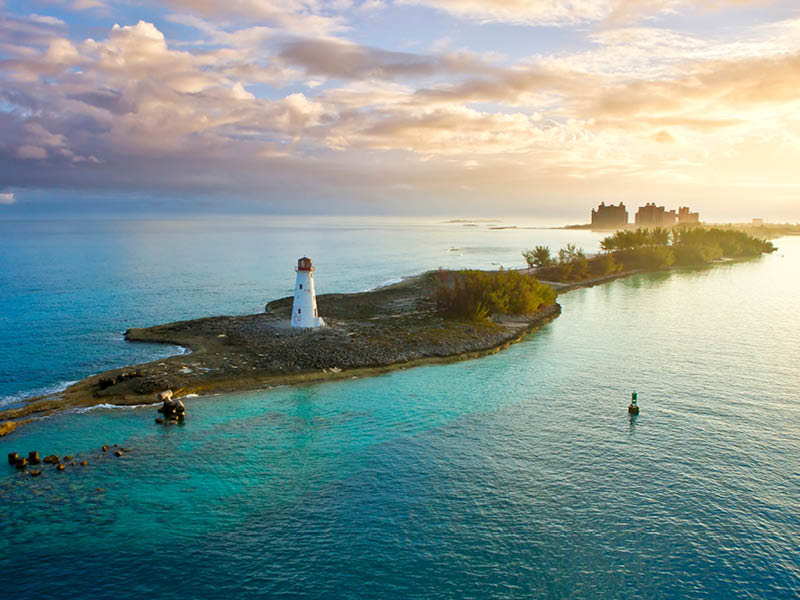 nassau bahamas, lighthouse, and paradise island at dawn