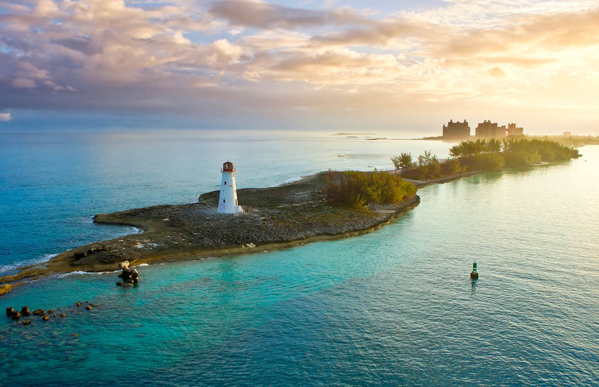 nassau bahamas, lighthouse, and paradise island at dawn