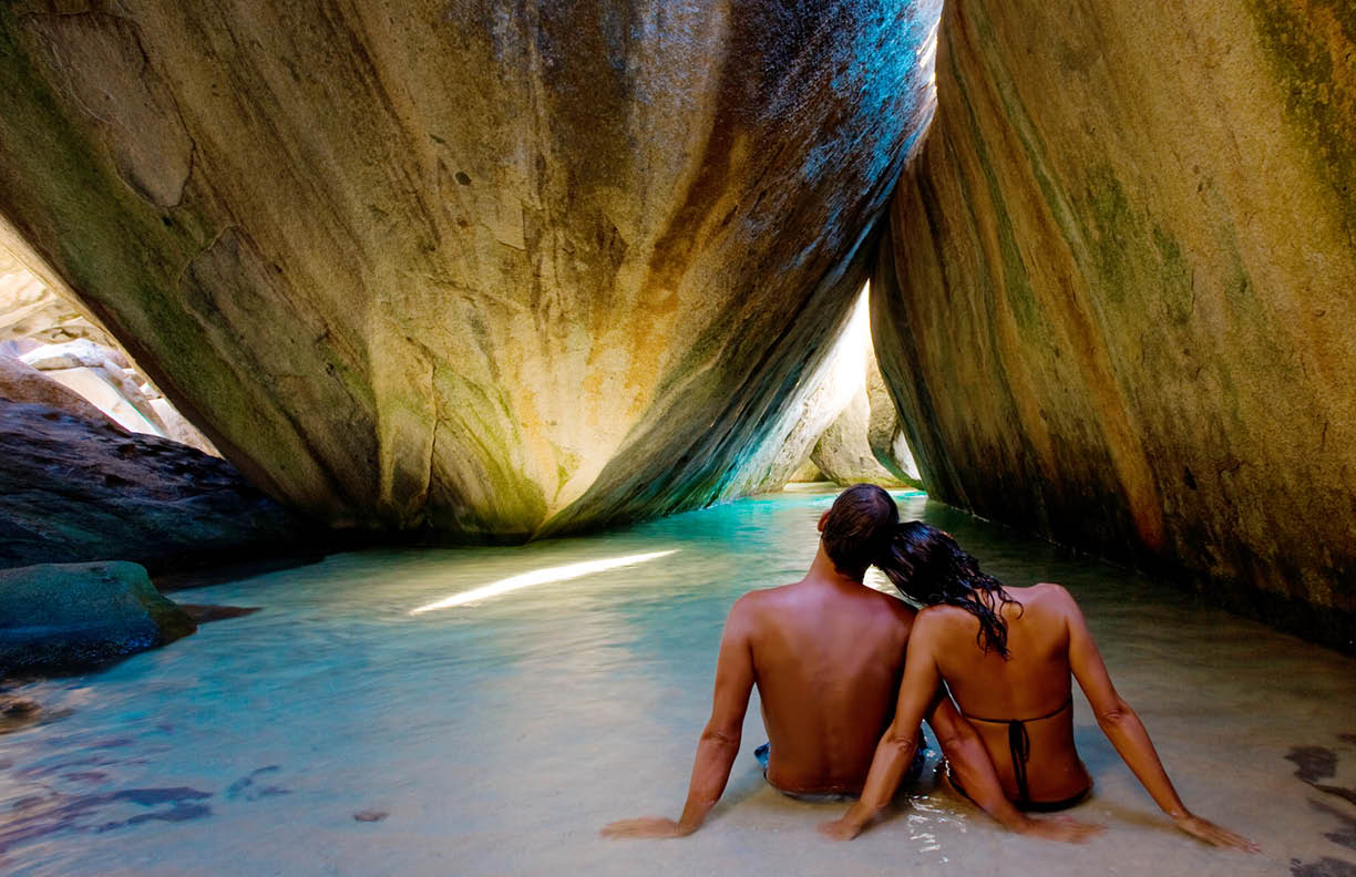 couple on beach at the baths in virgin gorda
