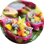 Exotic fruit salad served in half a dragon fruit