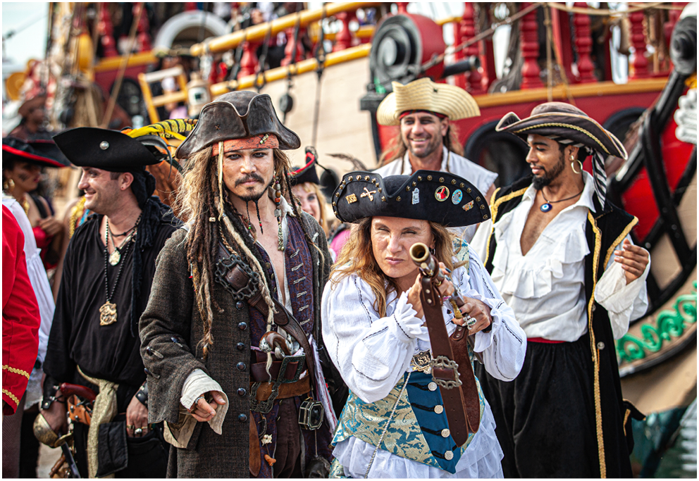 Johnny Depp Lookalike, Jolly Roger Pirate ship. men women dressed as pirate sword fighting,  Pirates Week 2012 from 8 to 18 November on November 10 2017 in Georgetown Cayman Island. Caribbean