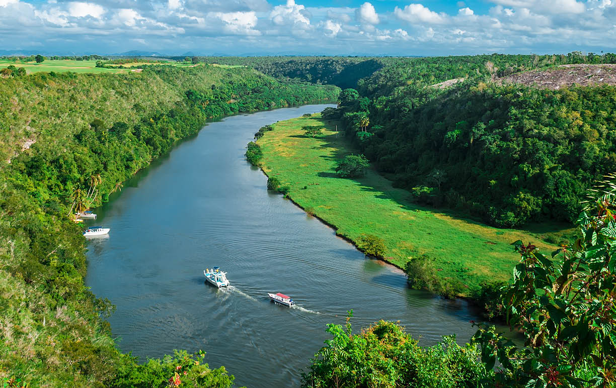 Crooked river flowing in the valley between two hills