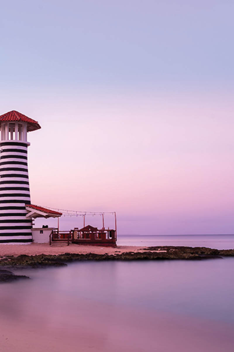Sunrise at Bayahibe beach with smooth water, La Romana, Dominican republic