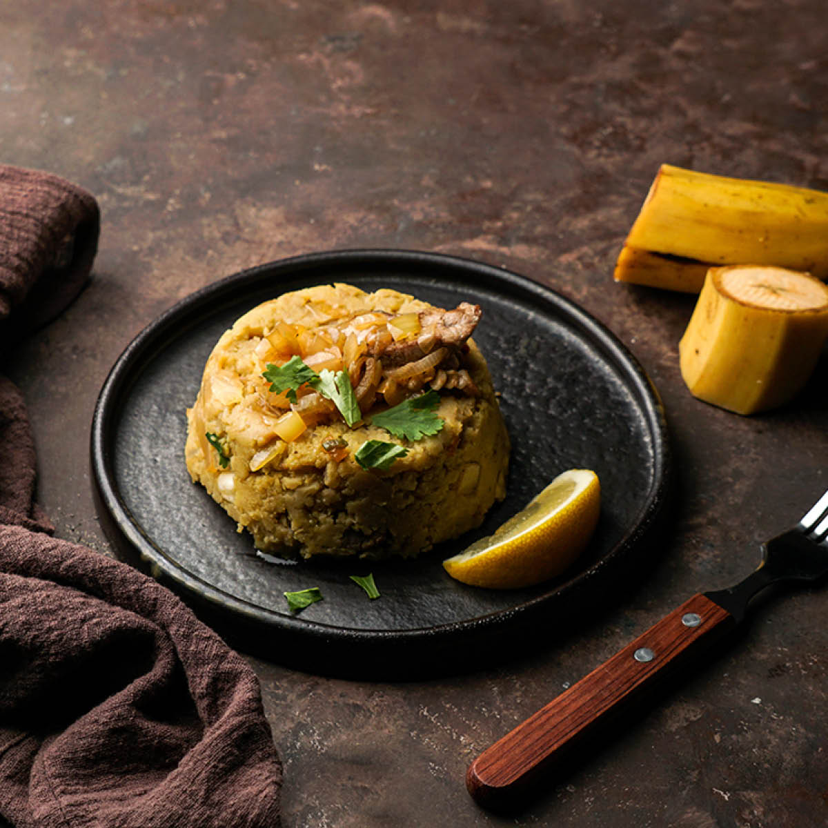 mashed boiled plantains with pork meat, onion. Puerto Rico.  Amazonian cuisine, Peru, Cuba