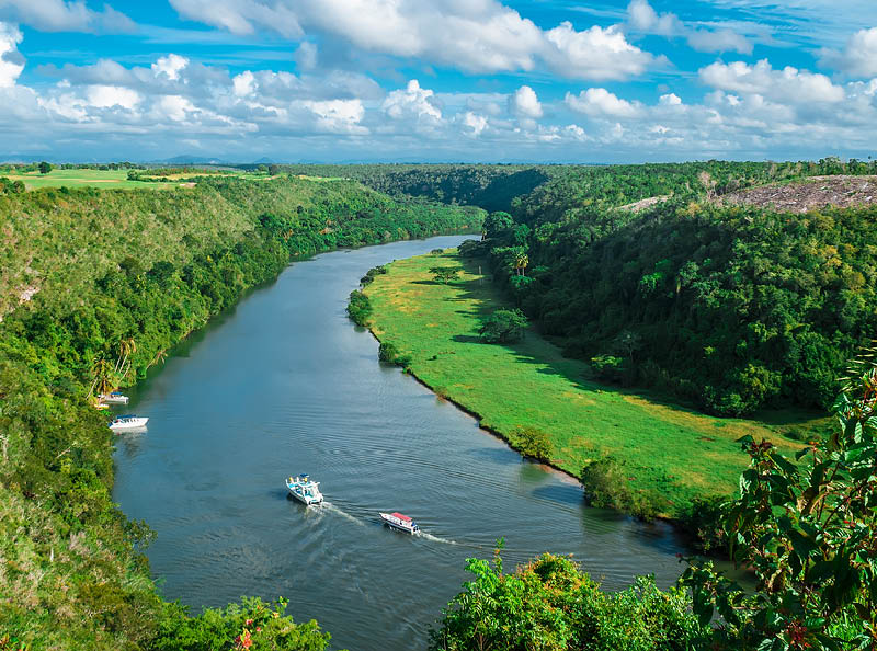 Crooked river flowing in the valley between two hills