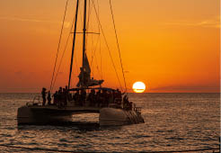 Catamaran sails at sunset in Bayahibe, Dominican Republic