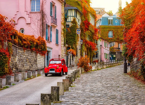 Cozy street in quarter Montmartre in Paris, France. Architecture and landmarks of Paris. Postcard of Paris