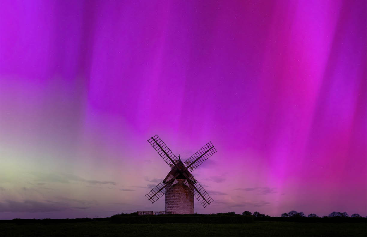 Northern lights in Normandy, France, Hauville stone windmill (Moulin de Pierre) and countryside