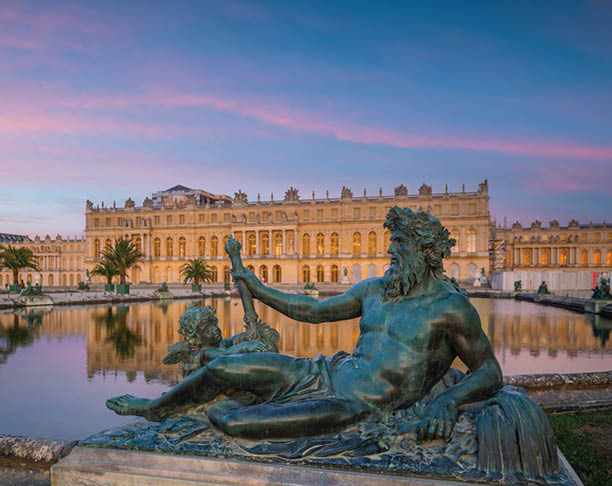 Garden of Chateau de Versailles, near Paris in France at sunset