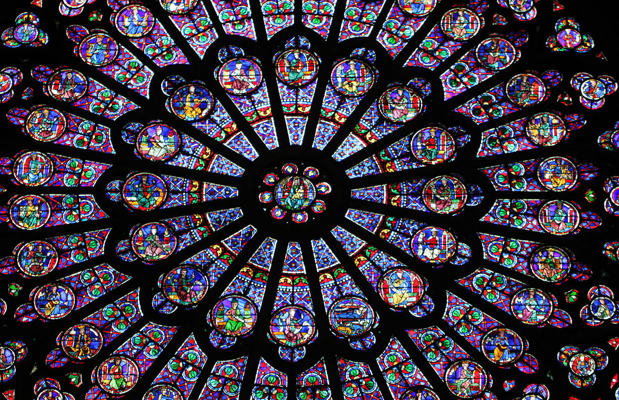 PARIS / FRANCE - AUGUST 28 2014: The North Rose window at Notre Dame cathedral. Stained glass