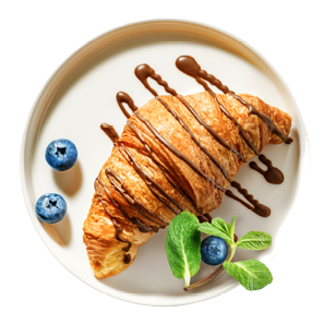 Freshly baked croissant with chocolate topping and blueberry on serving plate isolated on white background. Top view