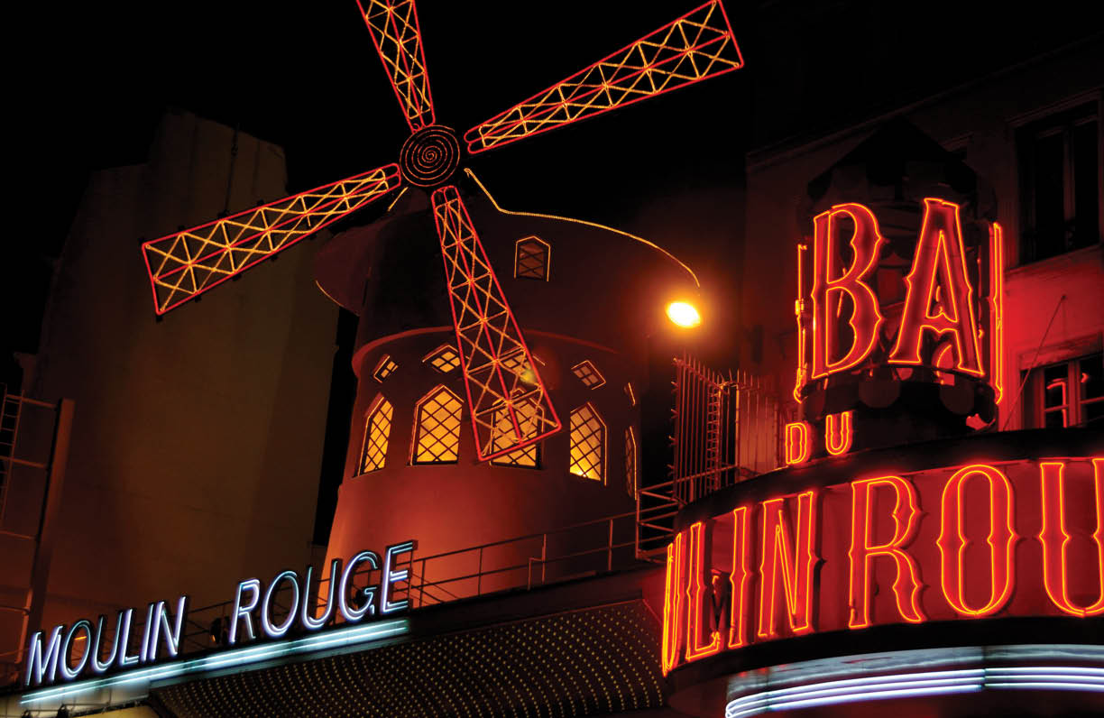 Paris, France - November 26, 2011: Moulin Rouge entrance in Paris. The Moulin Rouge is world famous for it's burlesque shows and has even featured in it's own movie.
