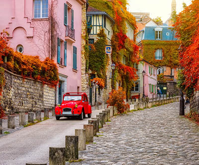 Cozy street in quarter Montmartre in Paris, France. Architecture and landmarks of Paris. Postcard of Paris