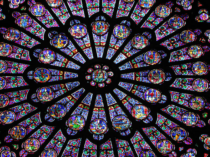 PARIS / FRANCE - AUGUST 28 2014: The North Rose window at Notre Dame cathedral. Stained glass