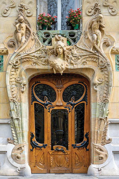 PARIS, FRANCE - APRIL 6: Door of the Lavirotte historical building from 1901, Art Nouveau architecture landmark on on April 6, 2024 in Paris, France
