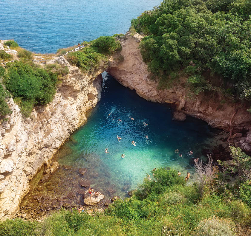 Natural swimming pool called Regina Giovanna in Sorrento with natural rock bridge, Italy. Ruins of a large Roman vila from 1st Century AC