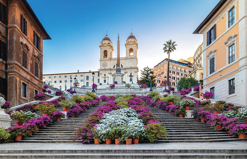Spanish Steps in the morning with azaleas. Spanish Steps is a famous landmark and attraction of Rome and Italy. 