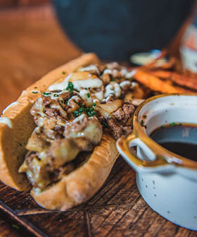 French dip sandwich with sweet potato fries and au jus