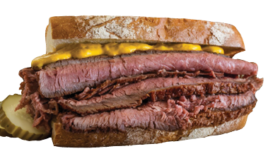 Smoked Meat Sandwich: A Montreal deli specialty, featuring tender, spiced smoked beef piled high on rye bread with mustard.