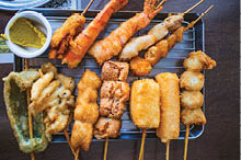 Kushikatsu, Delicious fried skewers with authentic wasabi served on a iron plate