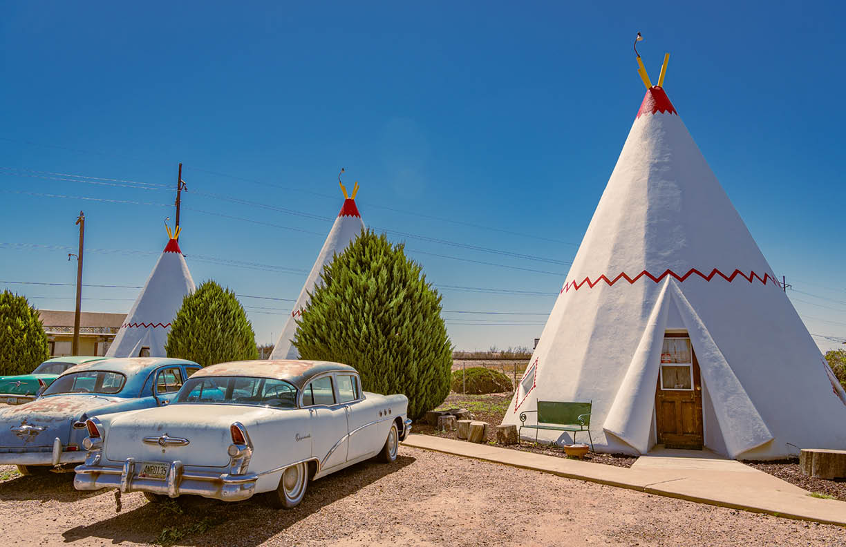 Holbrook, AZ, US-April 13, 2024: Wigwam Motel, part of a motel chain built during the 1930s and 1940s on historic Route 66. The rooms are in teepees with classic cars in front.