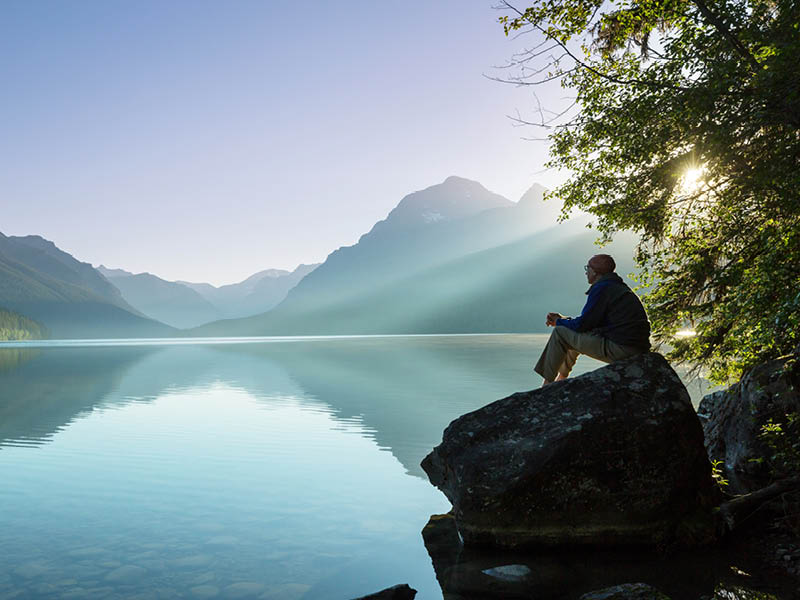 Beautiful Bowman lake with reflection of the spectacular mountains in Glacier National Park, Montana, USA.