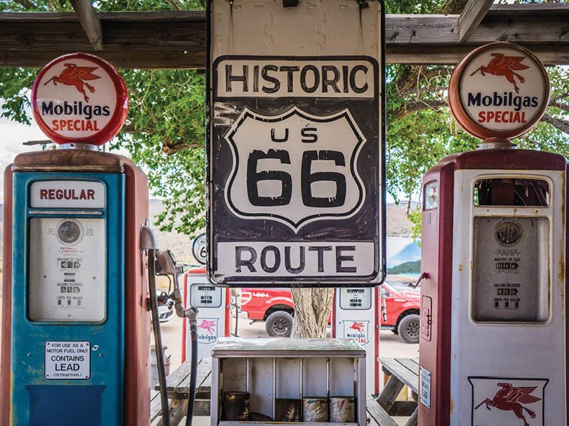 Kingman, Arizona, USA - May 14th 2019: Hackberry General Store, famous stop on the historical road 66. Antique Gas pumps and historical route 66 sign