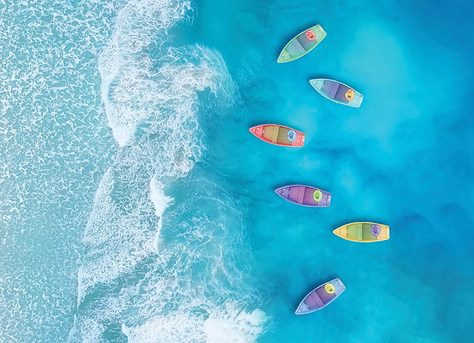 Boats from air. Aerial view on sea in Turkey. Summer seascape with clear water in sunny day. Top view of boats from drone. Summer seascape from air. Travel - image
