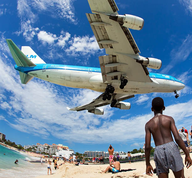 Aircraft KLM Asia / Boeing 747-406M / PH-BFY / FY-041 (cn 30455/1302) in flight. Plane is landing in Philipsburg / St. Maarten - Princess Juliana Airport near the beach