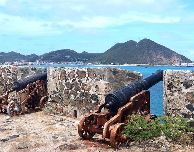 cannons in remains of historic Fort Amsterdam overlooking Philipsburg and Great Bay on the dutch side of caribbean island Sint Maarten