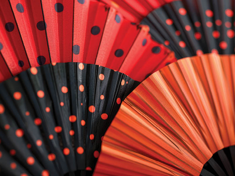 Fans in red and black with polka dots