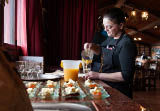Tenerife, Spain, January 2015: Waitress pours fresh juice for customers on Bodega Monje- one of leading wine manufactures on north of Tenerife