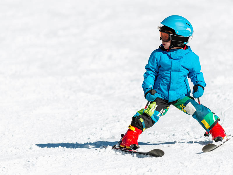 Little boy skiing, convenient copy space