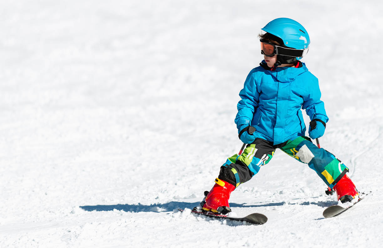 Little boy skiing, convenient copy space