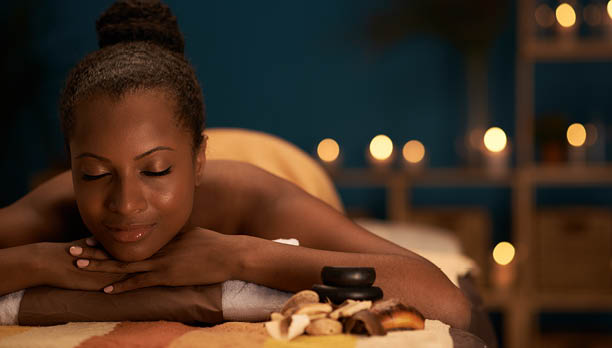 Lovely African-American woman spending her day in spa salon