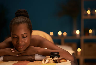Lovely African-American woman spending her day in spa salon