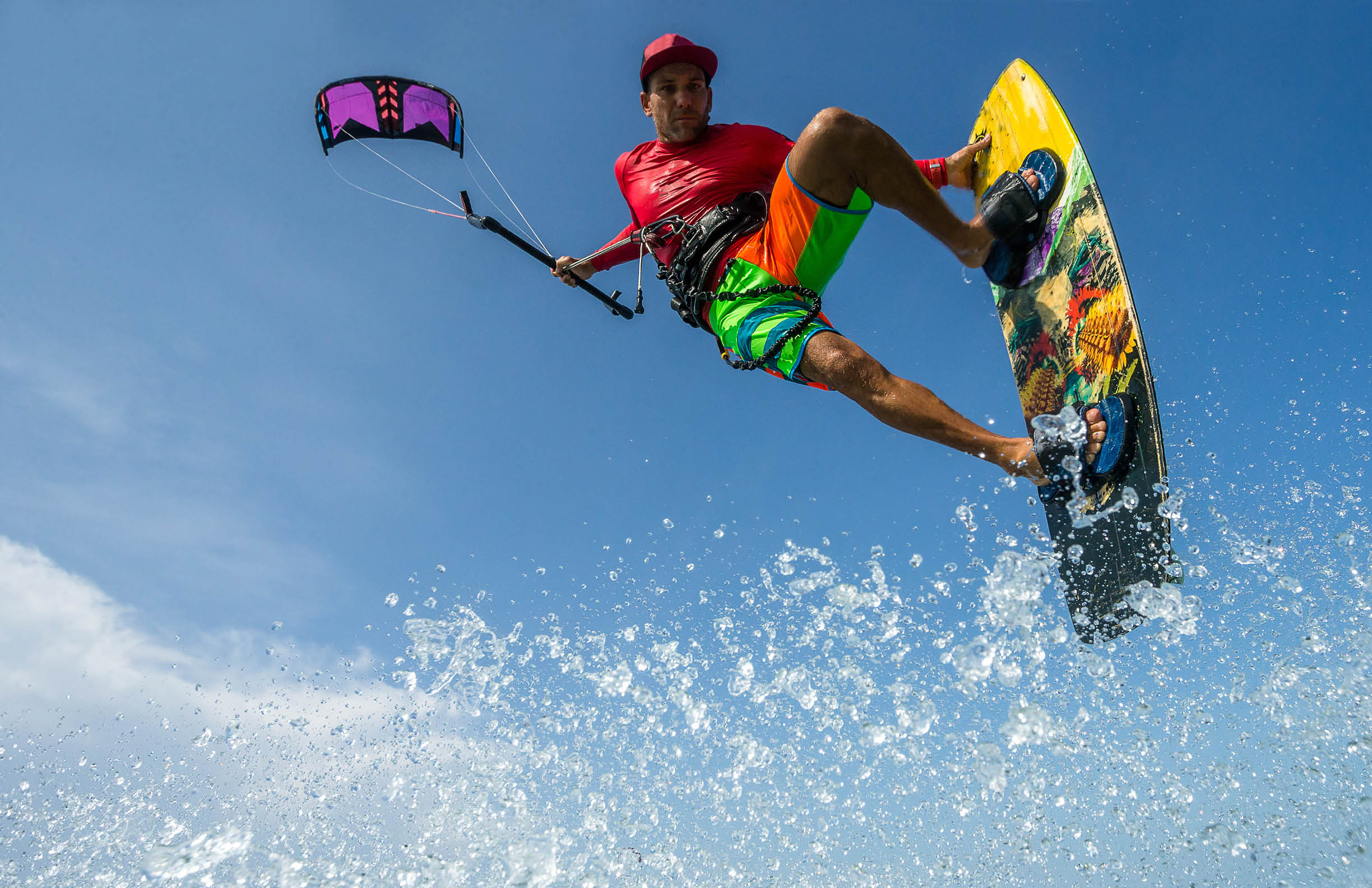 A kite surfer rides the waves