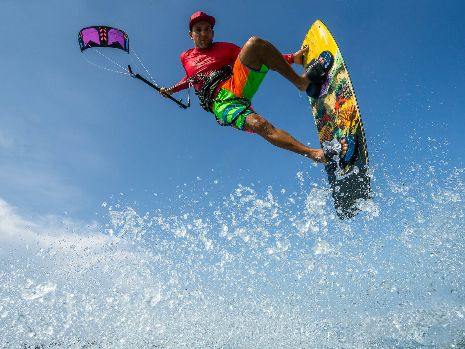 A kite surfer rides the waves