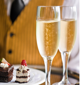 Server Serving Luxury Desserts and Champagne