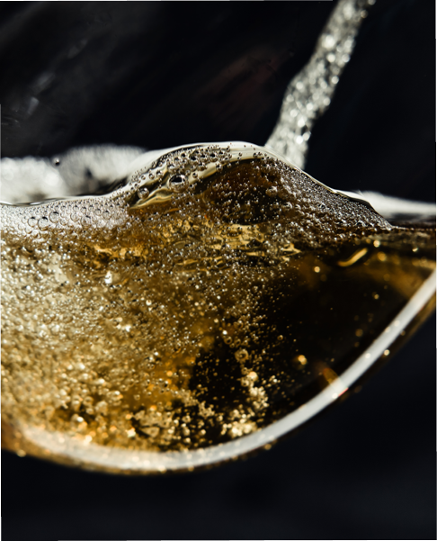 White wine being poured into a wineglass. 