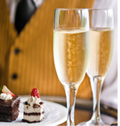 Server Serving Luxury Desserts and Champagne
