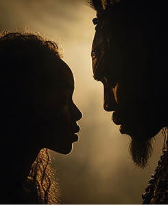 Silhouetted father and daughter facing each other.