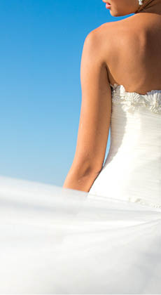 Close up bride dress against the sea