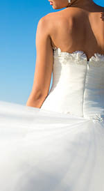 Close up bride dress against the sea