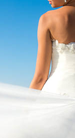 Close up bride dress against the sea