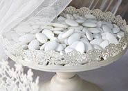 closeup of a wedding party, a vintage metal tray with colorful confetti in it 